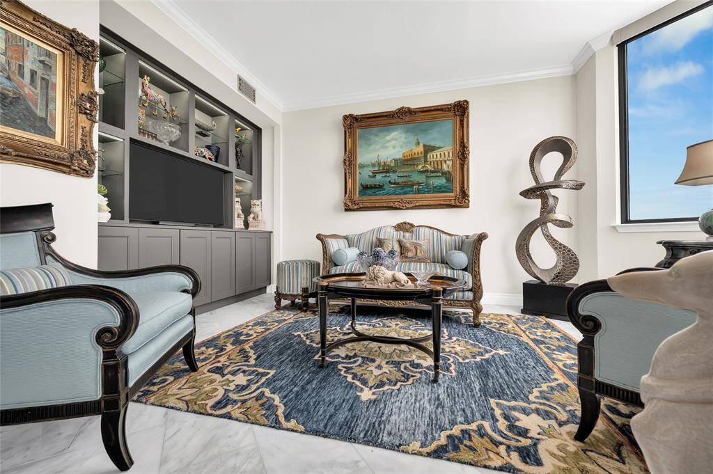 The guest bedroom has been opened to expand the living and dining room footprint. Appropriate as a den or study, this additional square footage can enhance the entertainment potential of your home.
