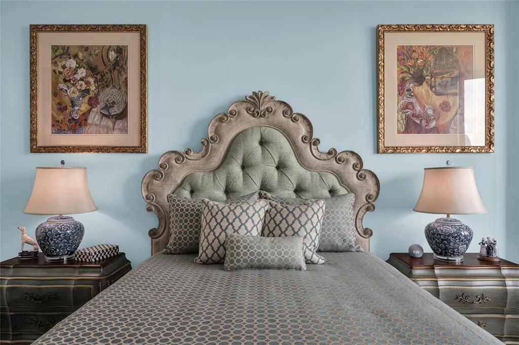 This stylish bedroom features an accent wall that adds depth and character to the space, creating a cozy and sophisticated retreat.