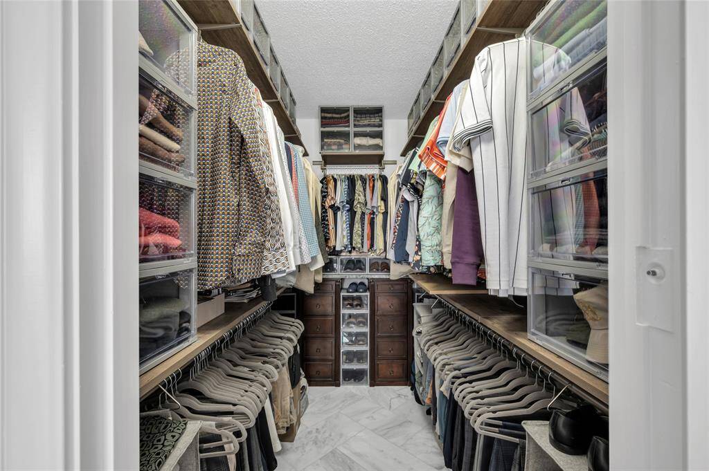 The primary bedroom closet has a professional layout and is very efficient.
