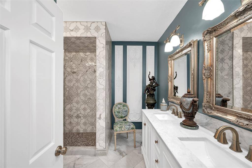 This beautifully designed bathroom offers a spa-like atmosphere with modern finishes and thoughtful details.