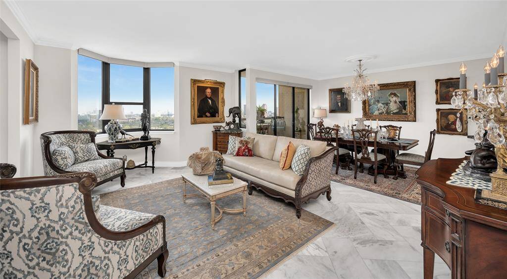 View of the open concept living and dining areas with balcony doors off the dining room with breathtaking views of the Galleria and Downtown.