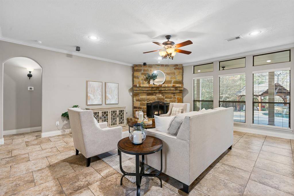 Family room with a beautiful stone fireplace.