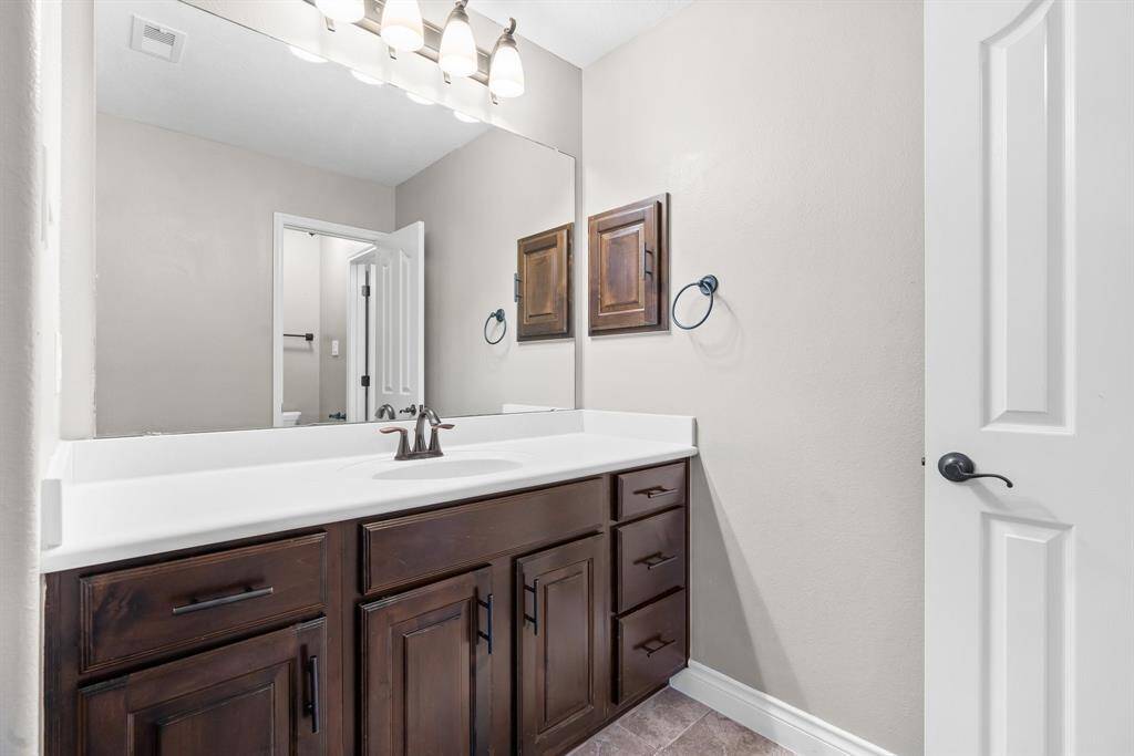 Lots of storage and counter space in the bathroom.