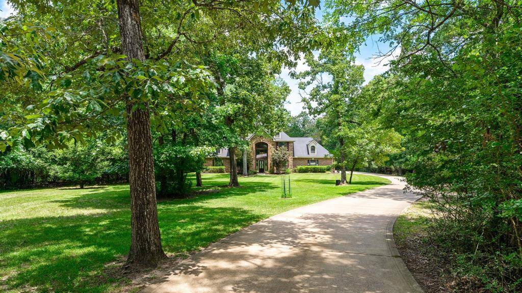Long driveway offers privacy from the street.