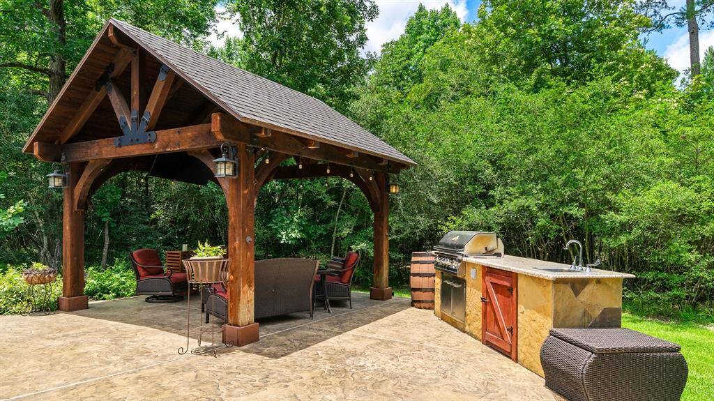 Beautiful pergola and summer kitchen is perfectly placed for entertaining.