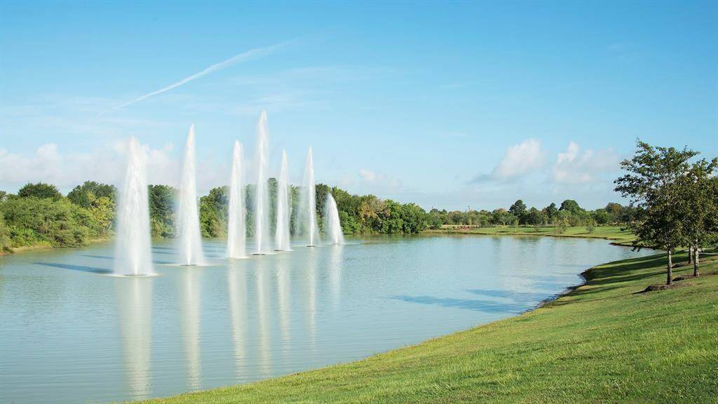 As you drive into Cane Island, you are greeted by the 7 fountains in the first lake. The fountains can and are color-coordinated depending on the season. So, whether red and green for Christmas or bright red each time the hometown team the Katy High School, Katy Tigers, rack up another WIN, the fountains are there to greet all of the neighbors and folks that drive by. Come by and take a look. It is also one of the picturesque backdrops for many folks in the area. Come by and take a look!