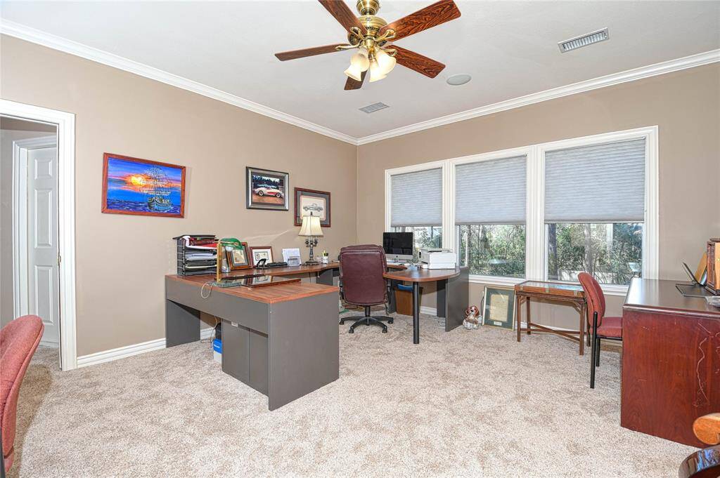 Upstairs Game Room with views of the back yard and private pool