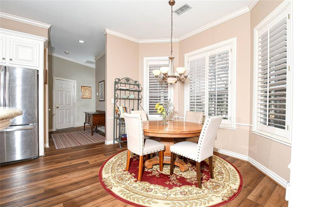 Large breakfast room with view of back yard landscaping