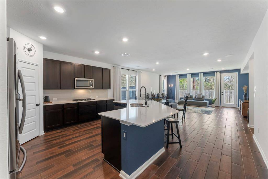 Designed for both style and function, this gourmet kitchen is truly the heart of the home, seamlessly opening to the dining and family room—perfect for entertaining.