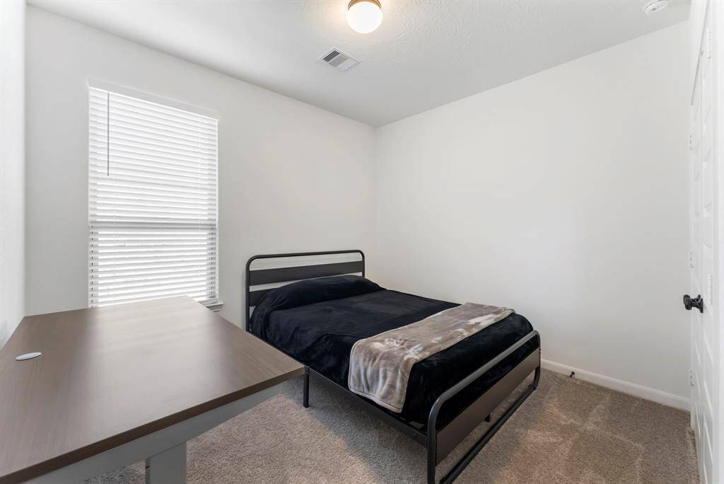 Secondary bedroom #2 has a double closet and carpet as well.  Great window!