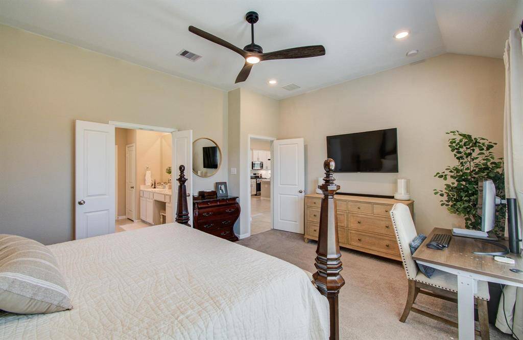 Goregous primary bedroom with soaring ceilings