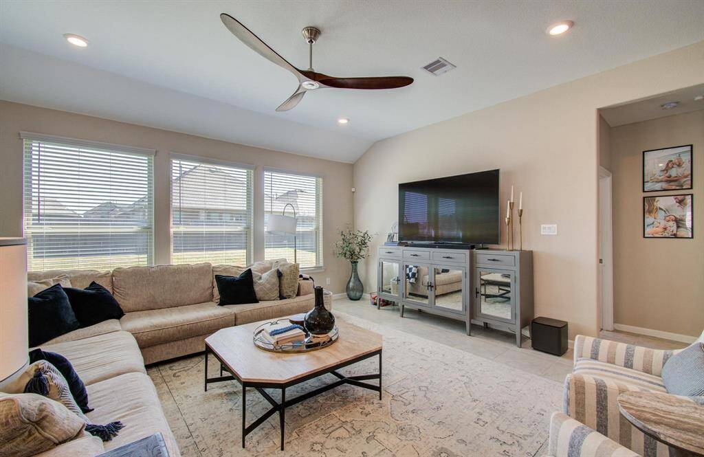 Family room is open to the kitchen, breakfast & dining area