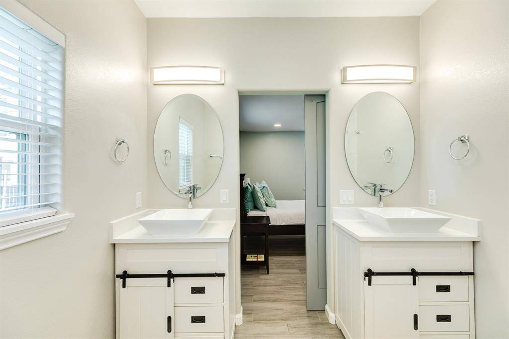 One of the 3 baths with double basins adjacent to the bedroom.
