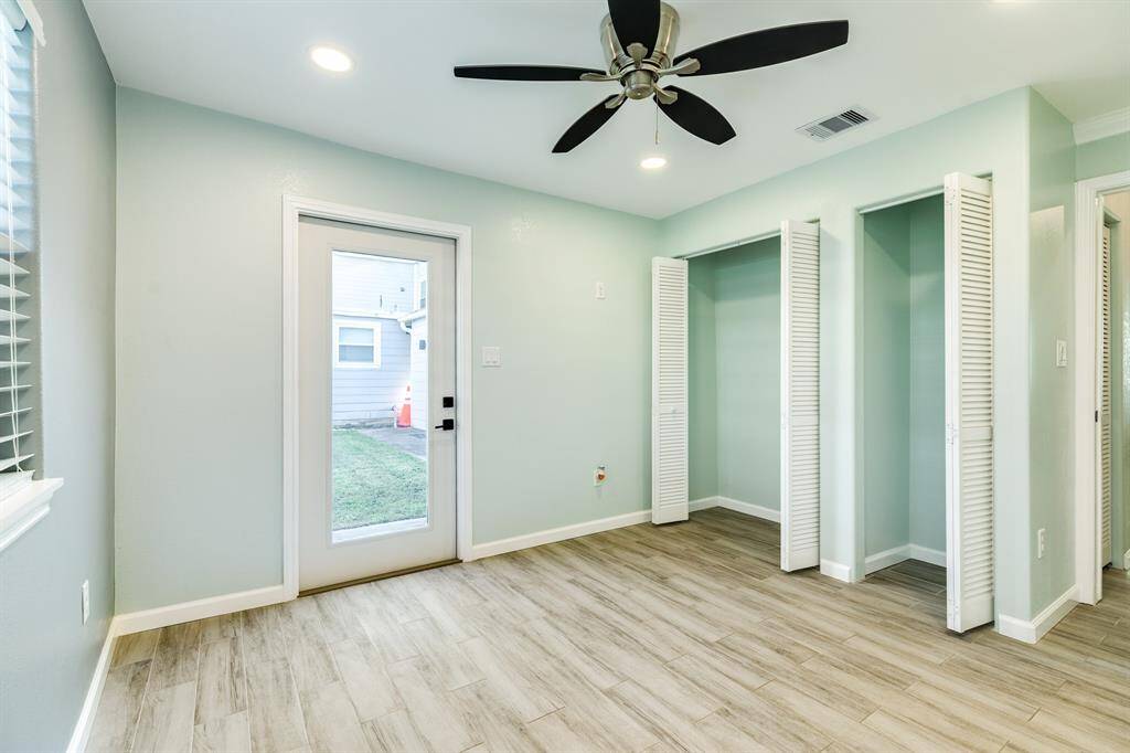 This vacant bedroom also has spacious closets.