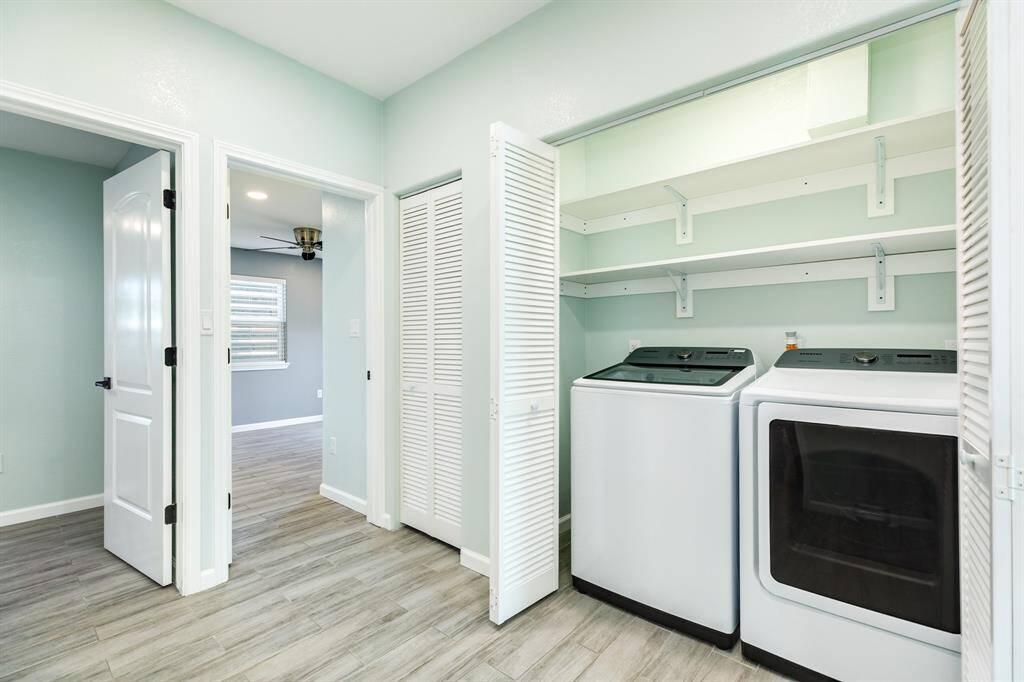 Spacious central hall area that has the utility closet and access to some of the bedrooms and baths.