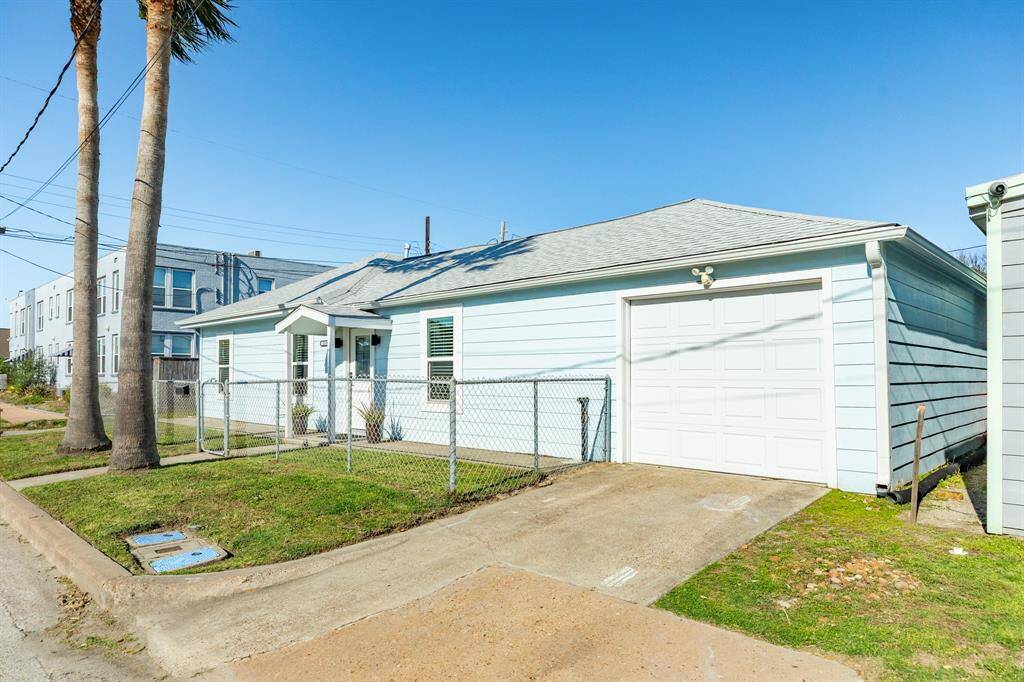 View of the home with the driveway leading to the one-car, attached garage.