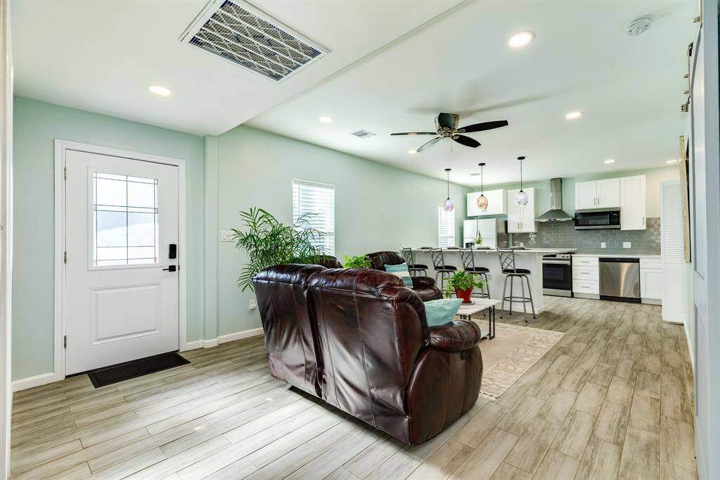 Living room open to the renovated kitchen.
