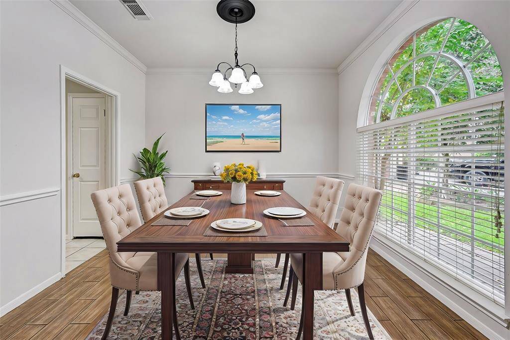 Virtually staged formal dining room.