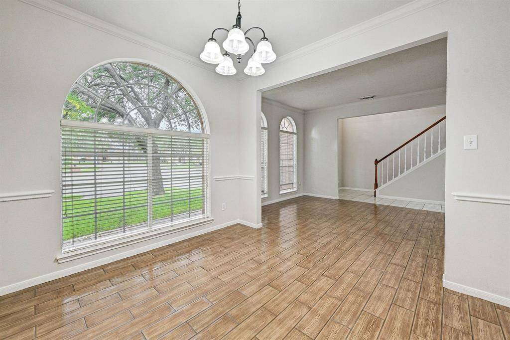 View from the dining room through the formal sitting room and to the front door.