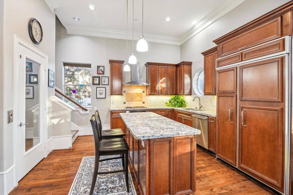 Kitchen-The kitchen features a panel-ready refrigerator under-cabinet lighting and breakfast bar
