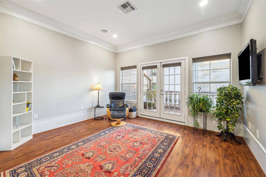 Secondary Bedroom III-This fourth floor retreat has French doors that lead out to one of two rooftop terraces