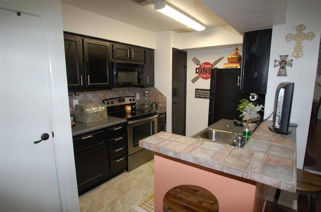 Kitchen with tile countertops