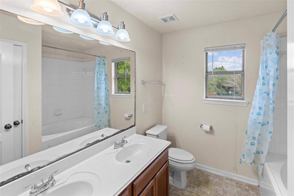Primary bathroom with dual sinks.
