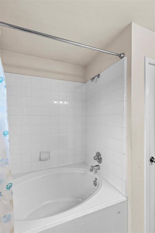 Primary shower and tub combo.