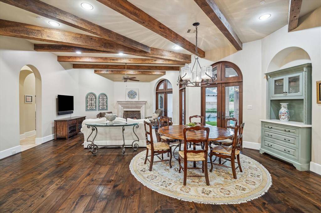 Morning room is great for large family gatherings; it has a custom built-in cabinet and hanging light fixture.