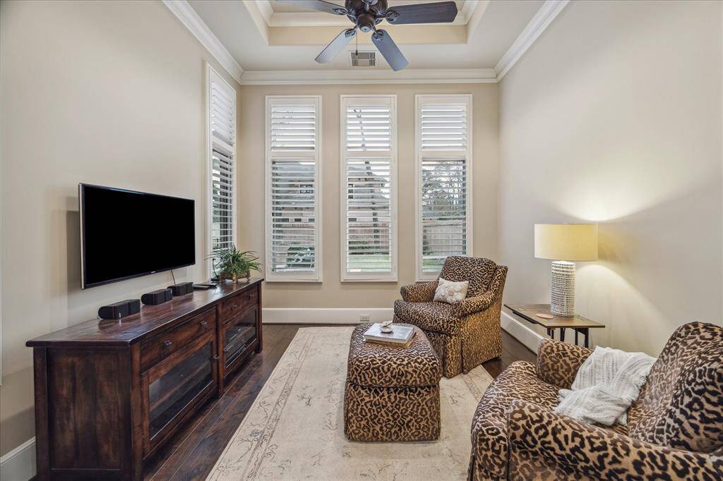Primary bedroom sitting room can be enclosed with a hidden pocket door.