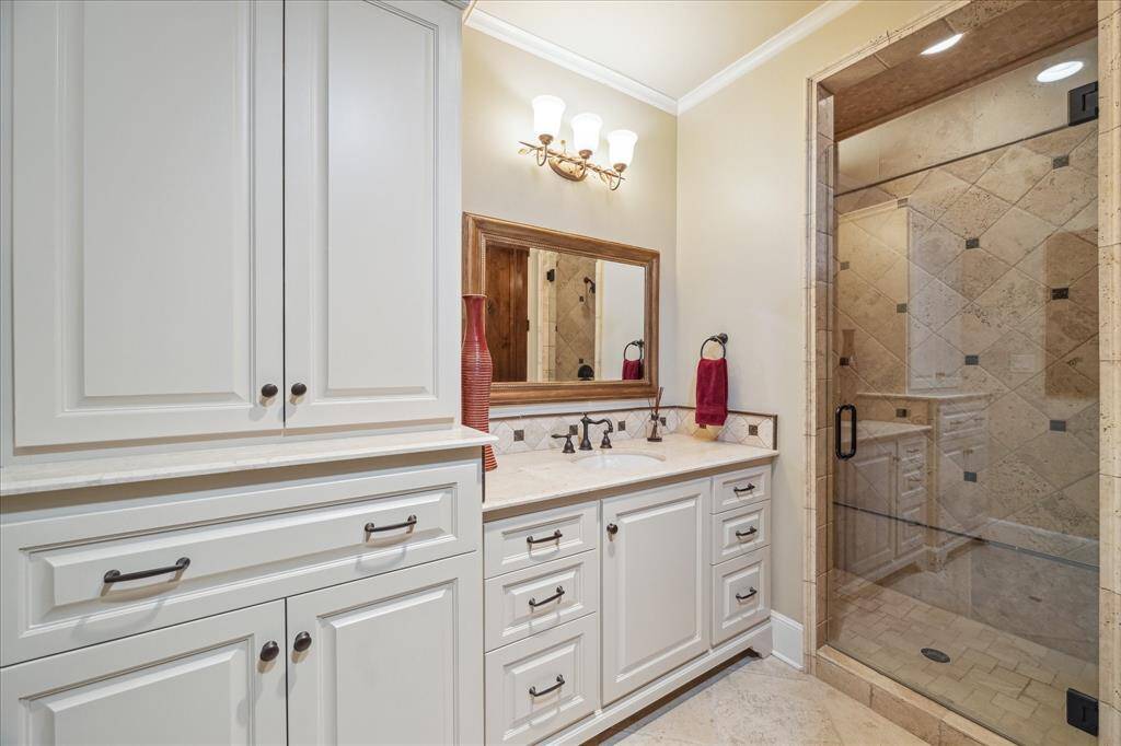 Secondary en-suit bath with walk in shower and water closet.