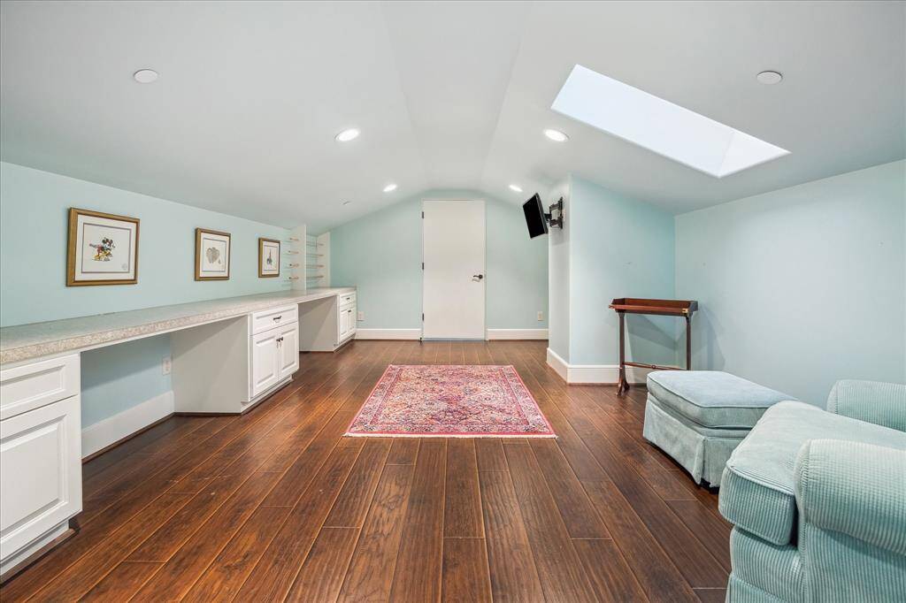 Hobby room or homework room with double built-in desks leads to playroom.