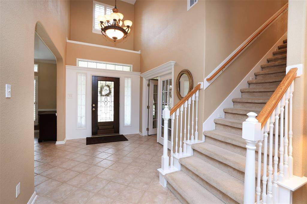 Custom designed richly stained wood built ins with cabinet storage.