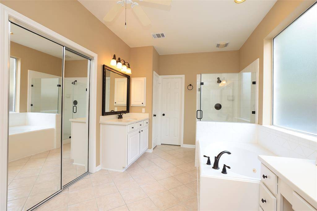 Newer faucets, framed mirrors and frameless shower 2025. Updated lighting.