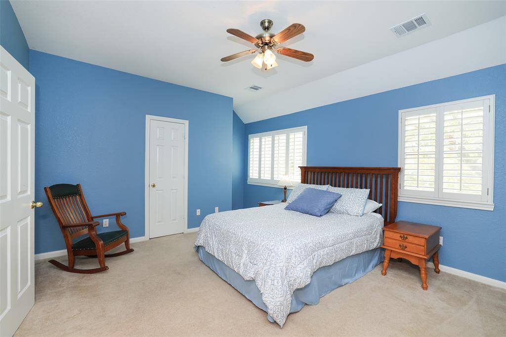 Secondary bedroom with walk in closet
