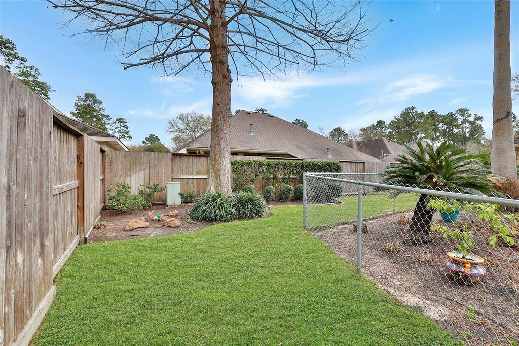 Green space and landscaped beds. Fully sprinkled with french drains to the front street area.
