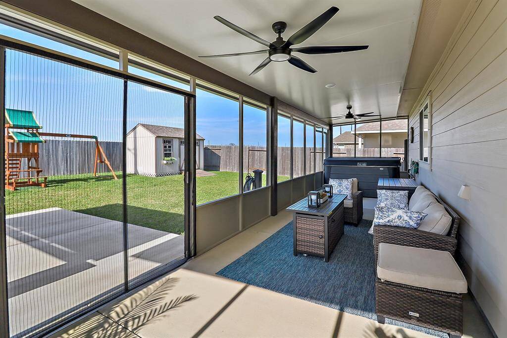 Back screened in porch with hot tub