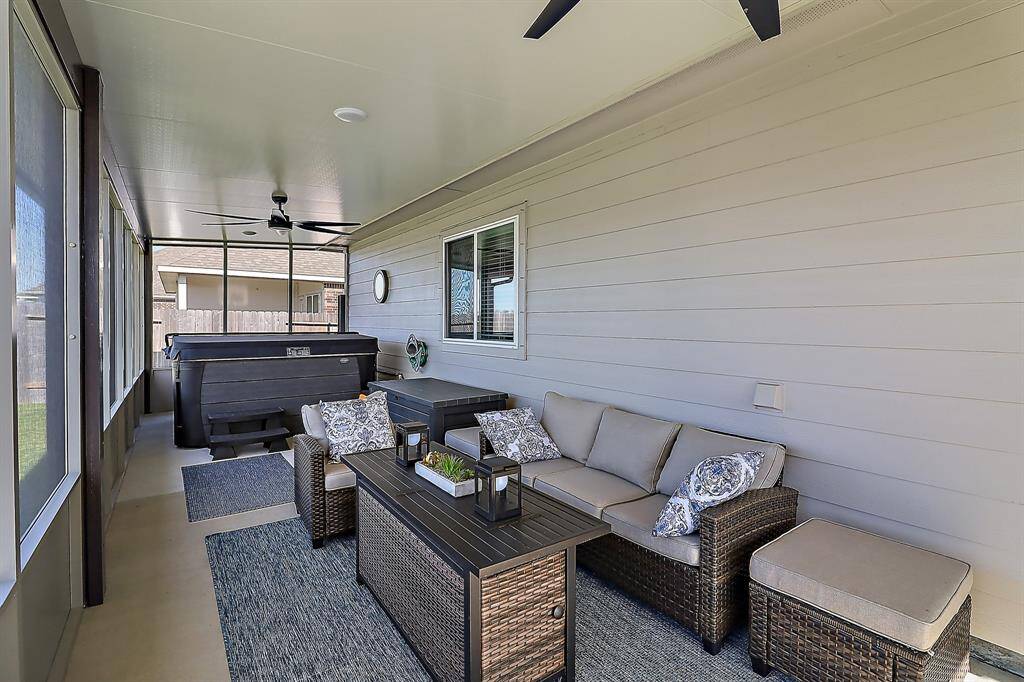 Back screened in porch with hot tub