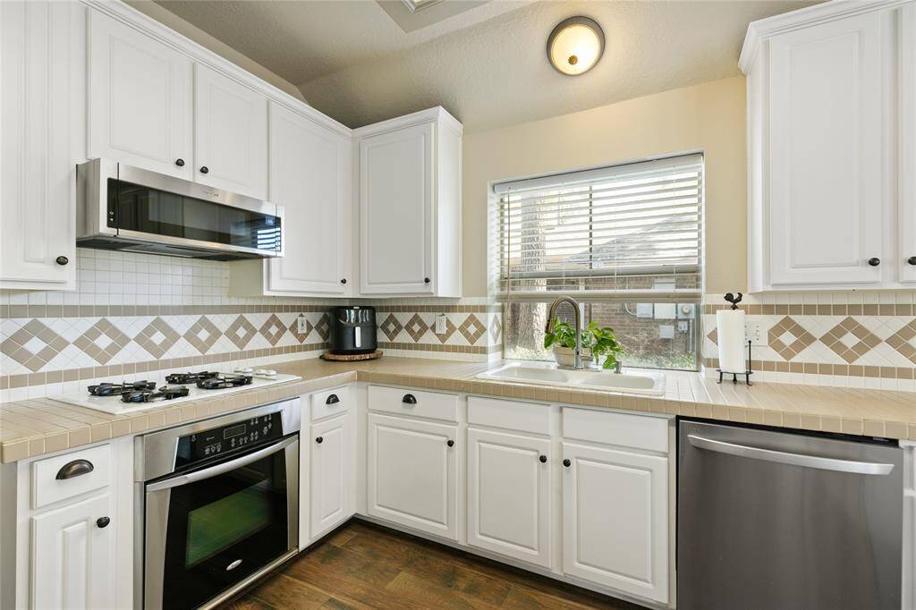 Gas cooktop, and stainless Oven, dishwasher, and microwave
