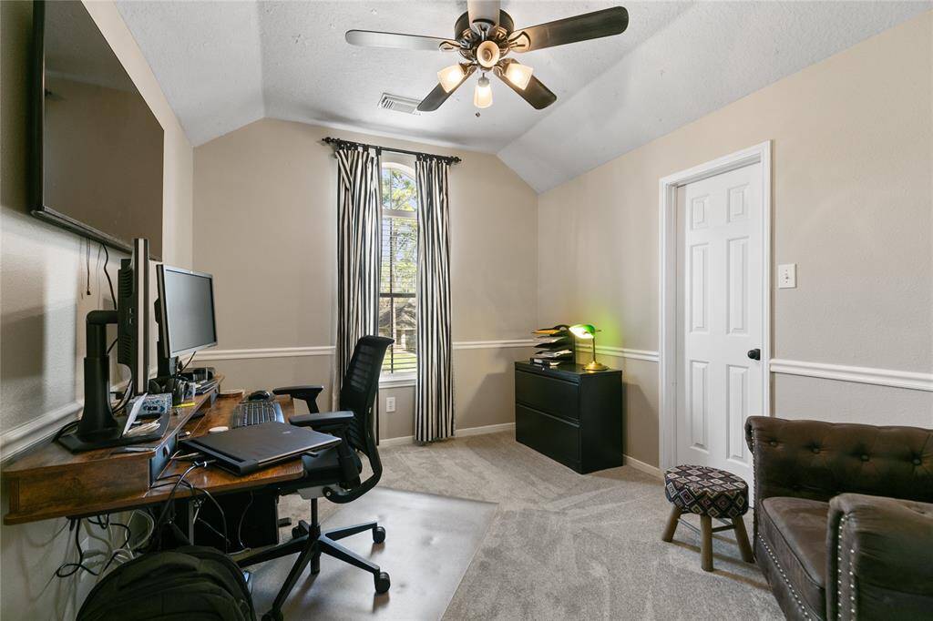 Bedroom upstairs with walk in closet  and chairrail. currently be used as office. paint and carpet 2025