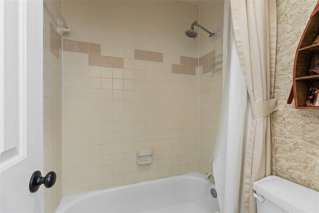 Hall bath up the tub and commode are seperated from sink area