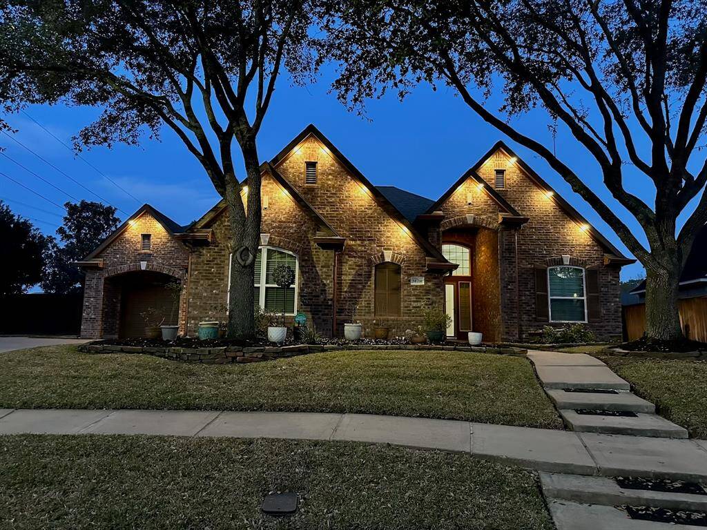 Home lights up beautifully at night with soffit lighting.