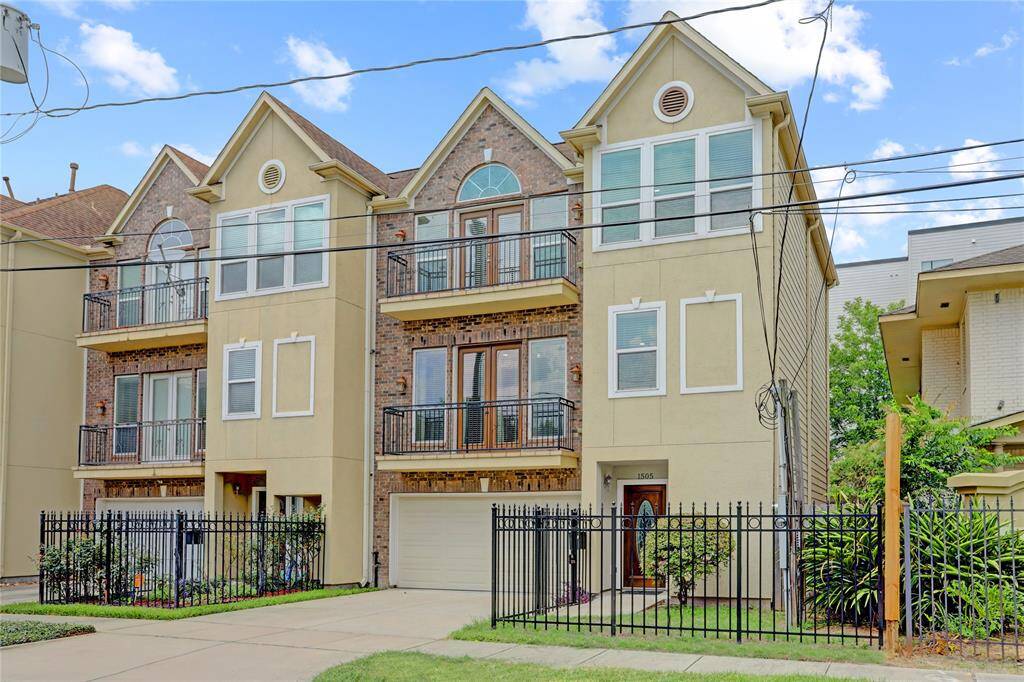 A private two-car garage with a dedicated driveway offers both convenience and additional parking space in this beautifully designed townhouse.