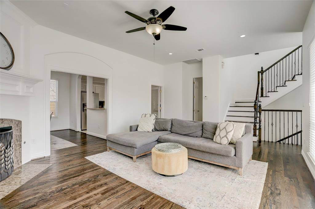 Another perspective of the open-concept living room, highlighting its seamless flow into the dining and kitchen areas.