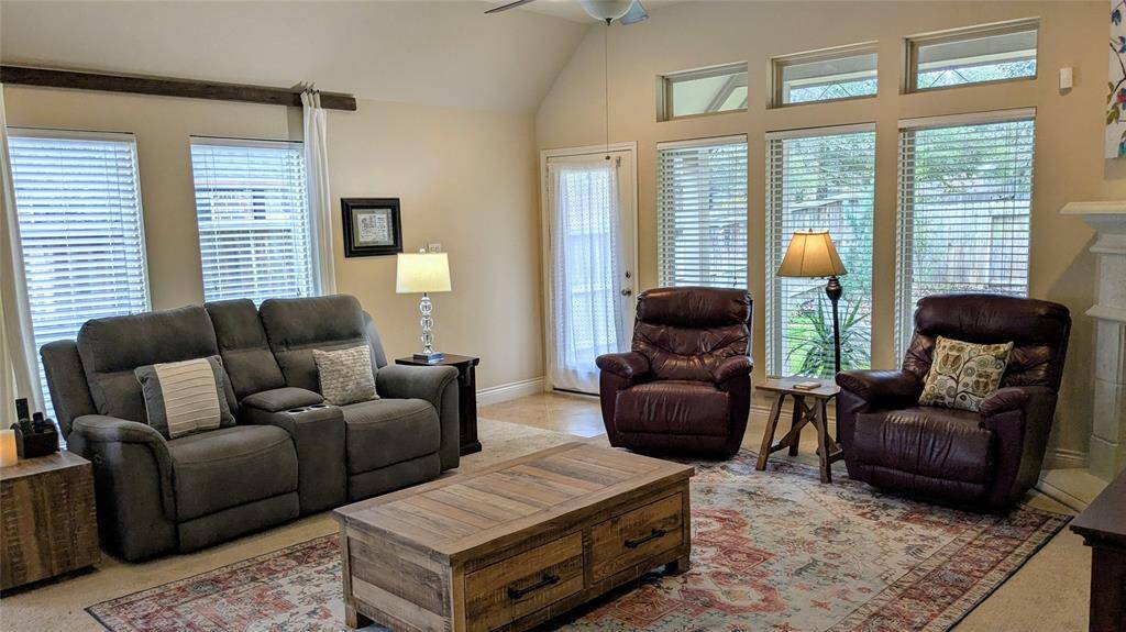 living room leads to outside covered deck