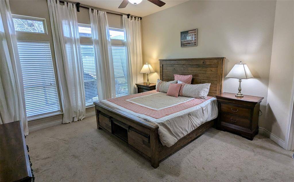 Spacious primary bedroom large enough for king size bed and side tables