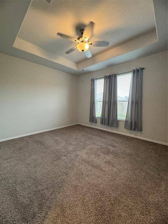 Half bath in hallway close to kitchen across from the primary bedroom