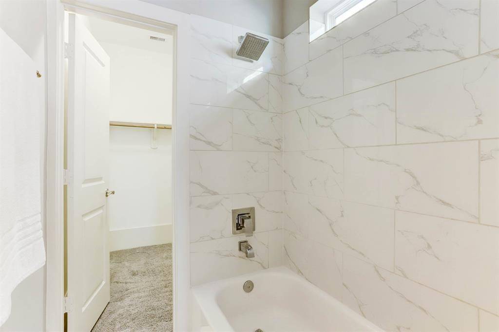 The first-floor bedroom features an en suite and walk-in closet!