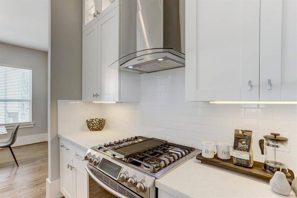 This kitchen is truly beautiful. The chef in your life will appreciate the gas stove, ample countertops for meal prep, and storage space galore!