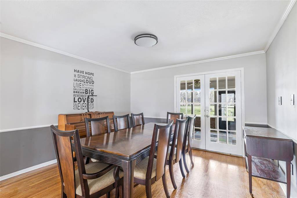 Formal Dining Room with double French doors into screened porch